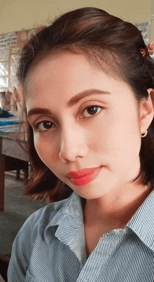 a close up of a woman 's face with red lips