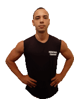 a man with his hands on his hips wears a black personal trainer shirt