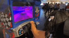 a girl is playing a video game with a checkered flag on the side