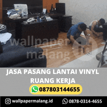 two men are installing a vinyl floor in a room