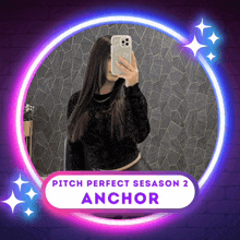 a woman taking a picture of herself in a pitch perfect season 2 anchor logo