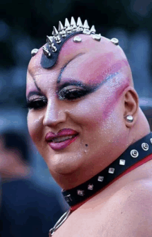 a woman with a crown on her head and a choker