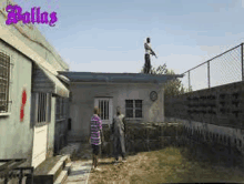 a man is standing on the roof of a house .