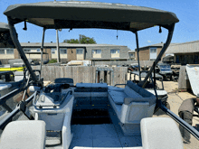 a boat with a roof that says ' yamaha ' on it is parked in a parking lot