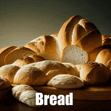 a bunch of bread sitting on a wooden cutting board with the word bread above it