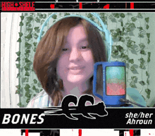 a girl wearing headphones stands in front of a blue microphone with the name bones on it