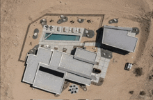 an aerial view of a house with a pool and the letters lcl on the roof