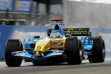 a blue and yellow racing car with the word elf on the side