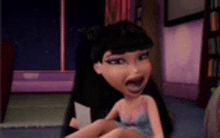 a bratz doll is sitting on a bed with her mouth open and a card in her hand .