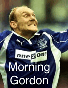 a man wearing a blue jersey that says one 2 one morning gordon