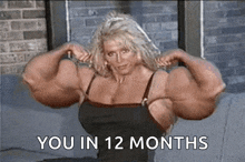 a woman with very large muscles is sitting on a couch with the words " you in 12 months " below her