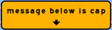 yellow sign that says message below is cap with an arrow pointing down