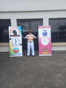 a man stands in front of king coach golf club signs