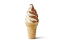 a close up of an ice cream cone with a swirl of ice cream on a white background .