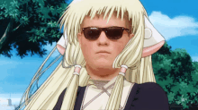 a man with blonde hair wearing sunglasses and a wig