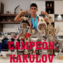 a boxer stands in front of trophies with the word campeon written in red