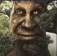 a statue of a man with a beard and a tree in his mouth .