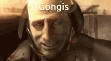 a close up of a man 's face with the word gongis above him