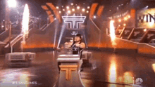 a nbc show called titangames is being played on a stage
