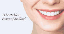 a close up of a woman 's smile with the words `` the hidden power of smiling ''