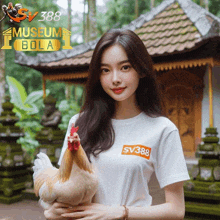 a woman holding a chicken in front of a building with the words museum bola on it