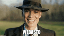 a man wearing a hat and a suit is smiling with the word webasto written below him