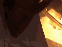 a close up of a fire coming out of a building .
