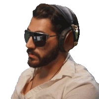 a man wearing sunglasses and headphones looks to his left