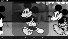 a black and white drawing of mickey mouse on a phone screen