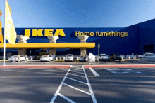 an ikea home furnishings store with cars parked in front