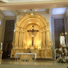 a church altar with a cross and candles