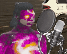 a person with purple paint on their face is singing into a microphone with a car in the background