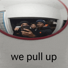 a group of people are taking a selfie in a mirror with the words " we pull up " above them