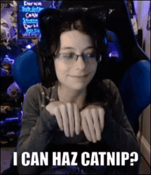 a girl wearing glasses and a cat ear headband says i can haz catnip ?