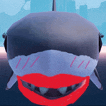 a shark with a red mouth and teeth is smiling