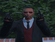 a man in a suit and tie is giving a middle finger