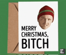 a card that says merry christmas bitch with a picture of a man 's face