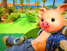 a man wearing a pig mask takes a selfie in a chair