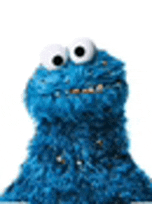 cookie monster from sesame street is looking up at the camera with big eyes .