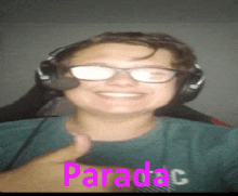 a man wearing glasses and headphones is smiling and giving a thumbs up with the word paradac in pink