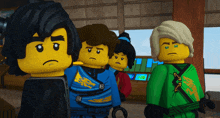 a group of lego figures are standing in a room