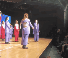 a group of women are standing on a stage in front of a screen that says ' google ' on it