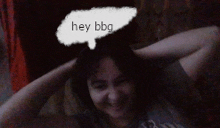 a woman with her hands behind her head with a speech bubble saying hey bbg