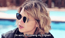 a woman wearing sunglasses says " oh sorry i 'm looing my english "