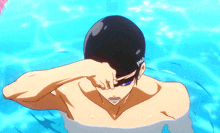 a man in a swimming cap is covering his eyes