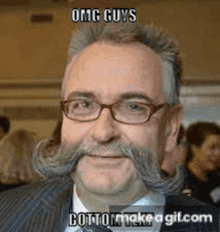 a man with glasses and a mustache says omg guys cottonmakeagif.com