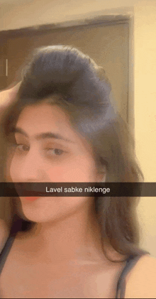 a woman taking a selfie with a caption that says lavel sabke niklenge