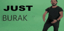 a man in a black shirt is dancing in front of a green background that says just burak on it