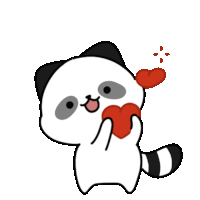 a black and white cat is holding a red heart