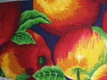 a painting of red and yellow apples on a blue background